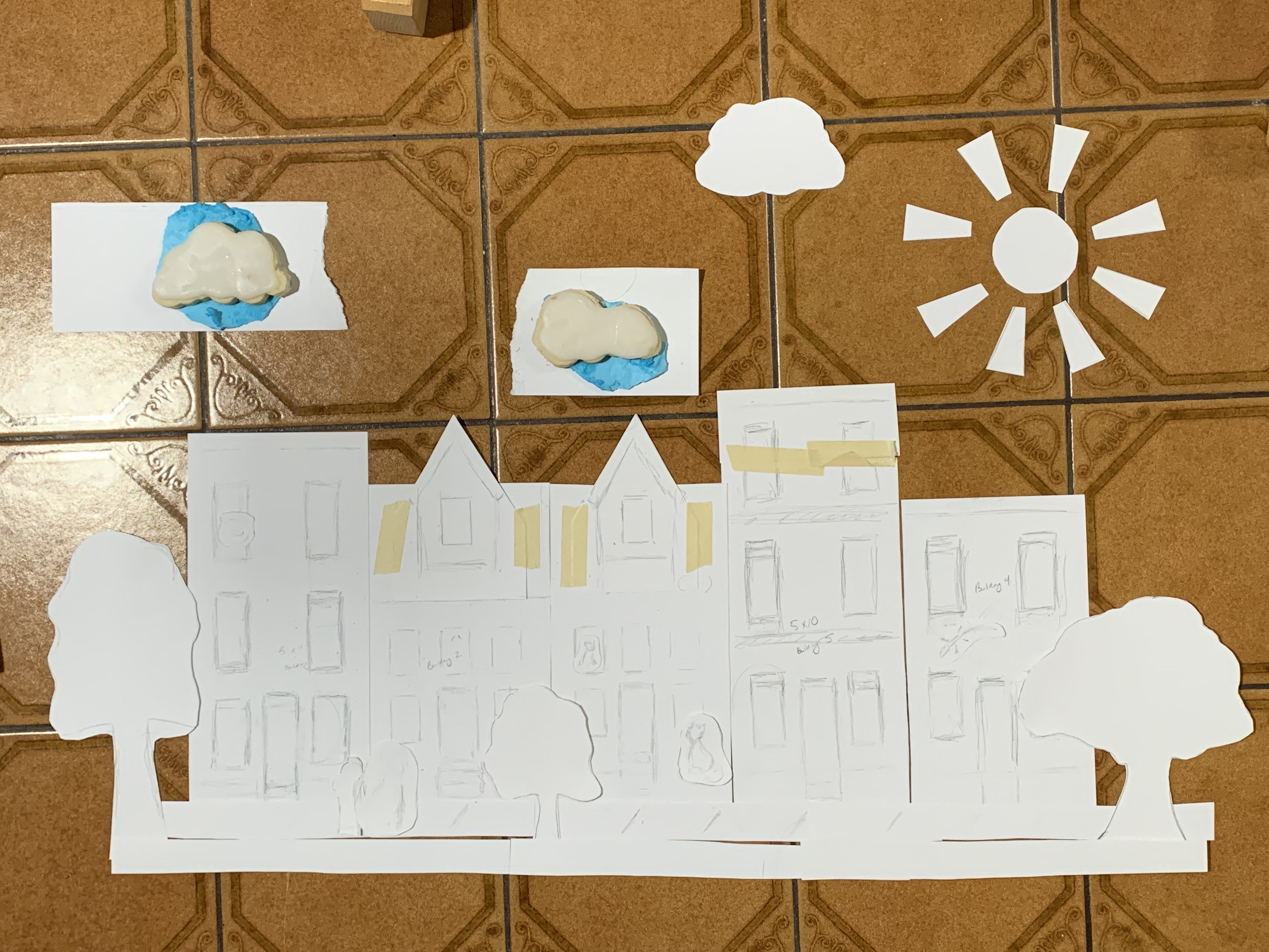 Laying out the cardstock pieces for the model, which also doubled as my cookie cutter templates.