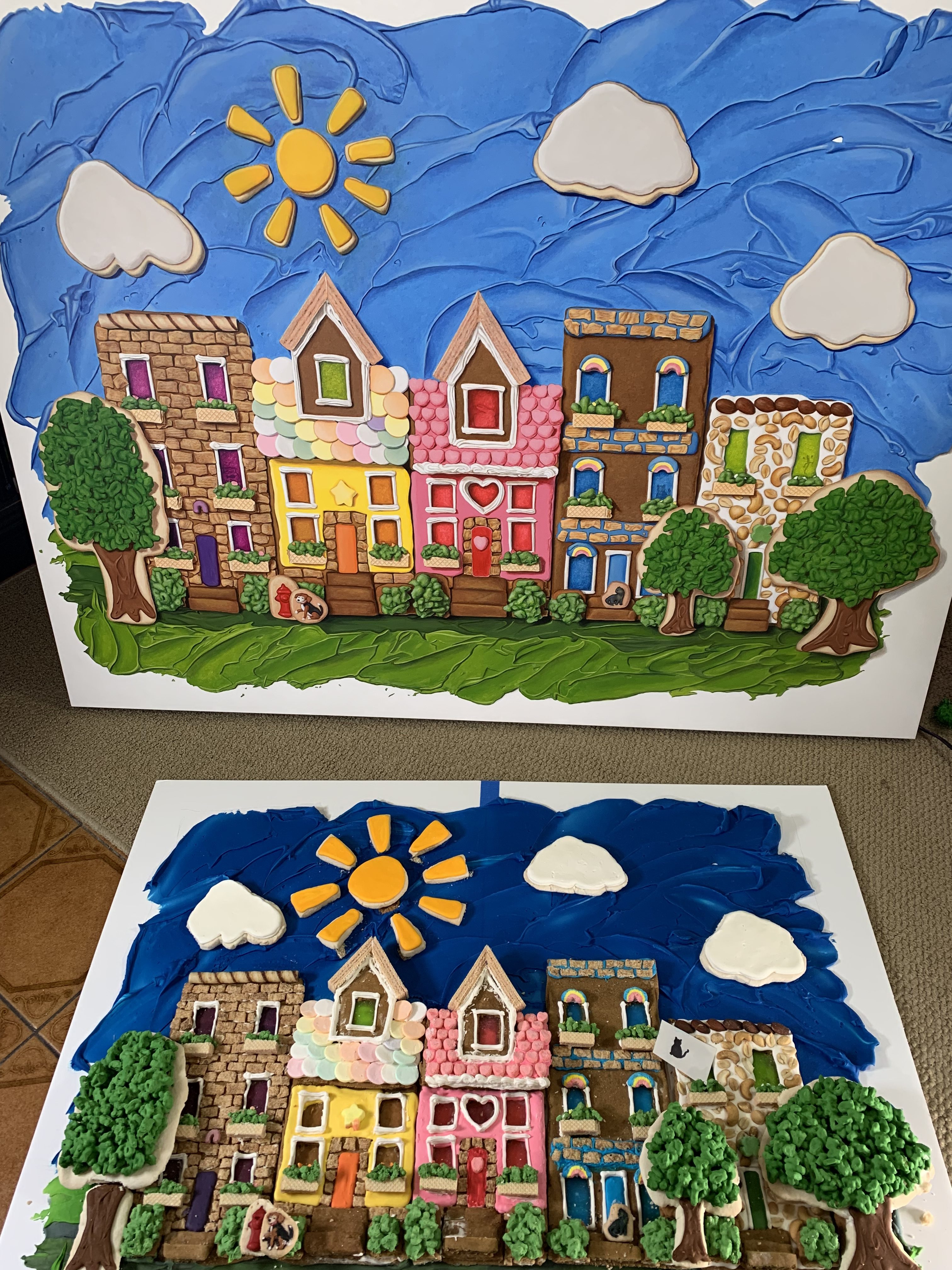 The final painting next to the baked and decorated cookie model.